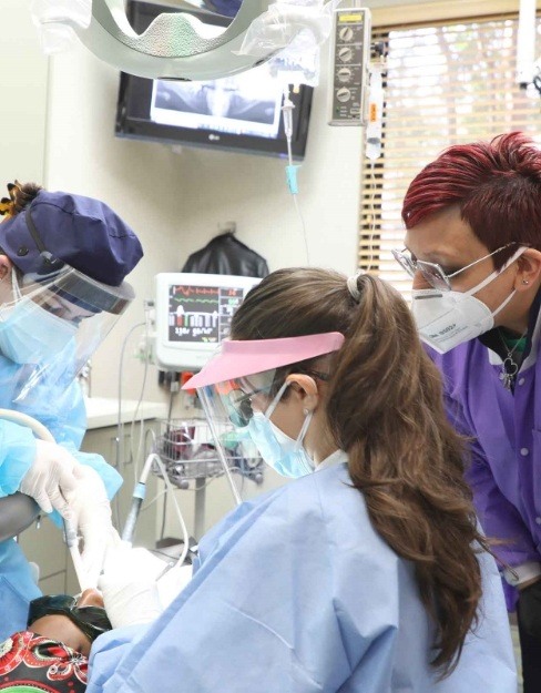 Dentist and dental team members providing emergency dentistry