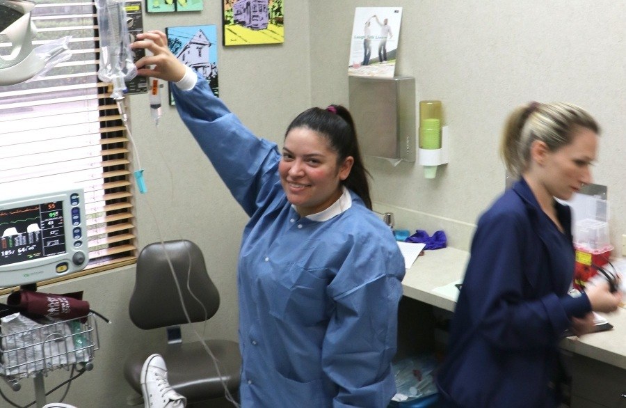 Houston dental staff member adjusting I V drip