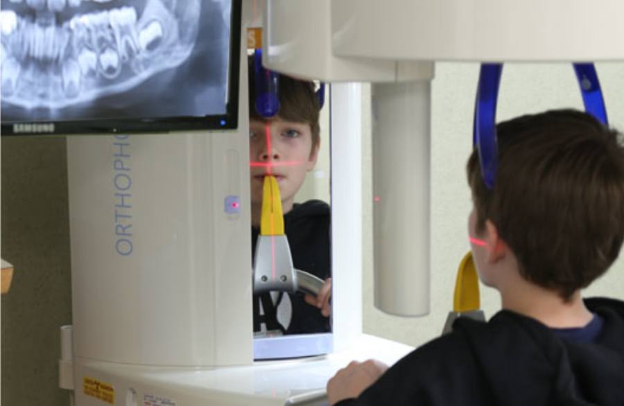 Young boy receiving a digital dental scan in Houston
