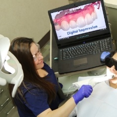 Patient getting digital dental impression taken in Houston