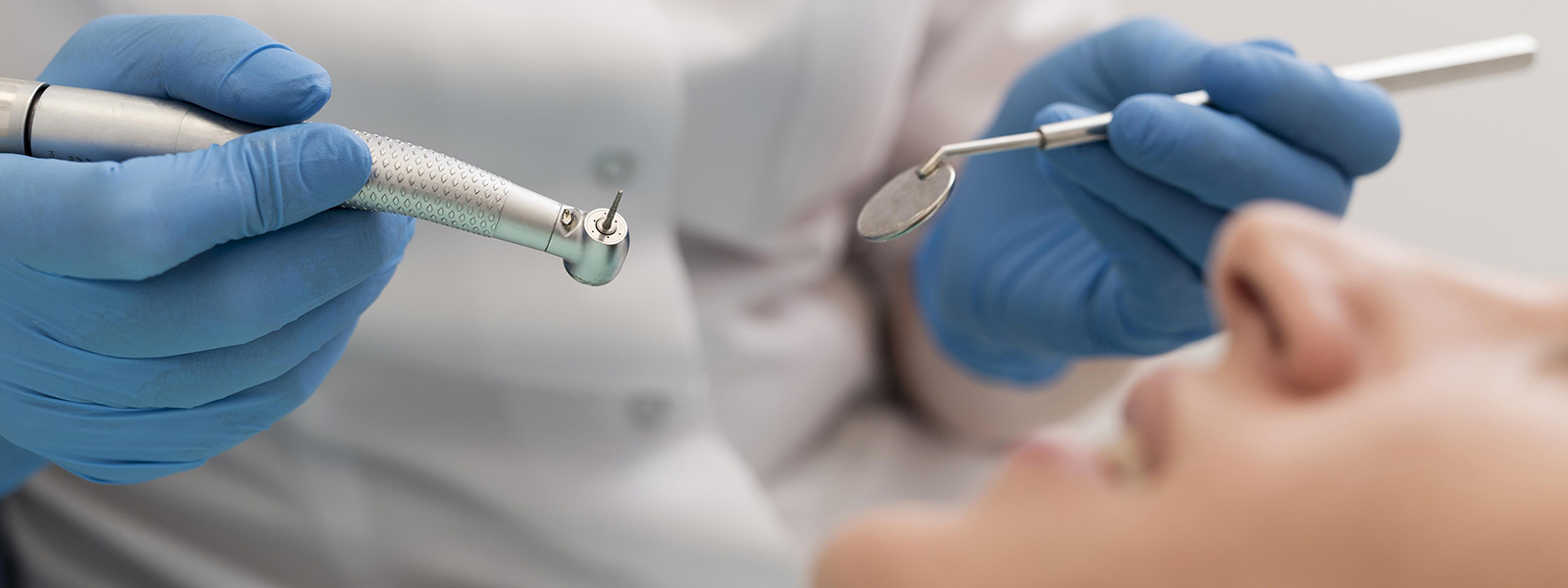 female patient having procedure done dentist