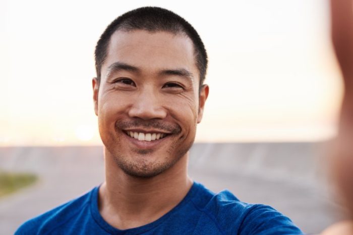 man smiling while outside
