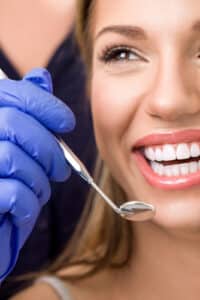 Woman with healthy smile after root canal treatment in Houston, TX