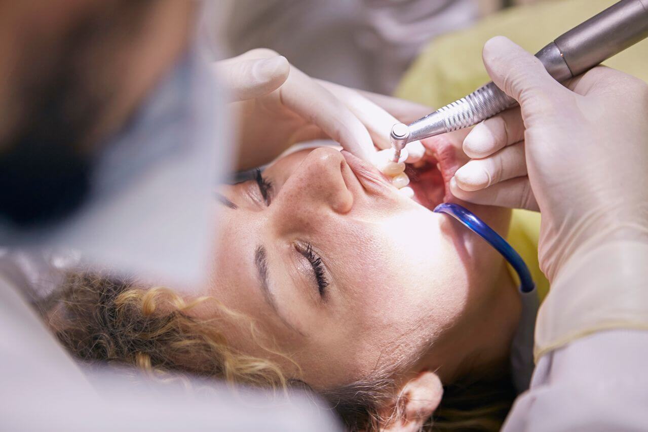 Woman receiving dental cleaning